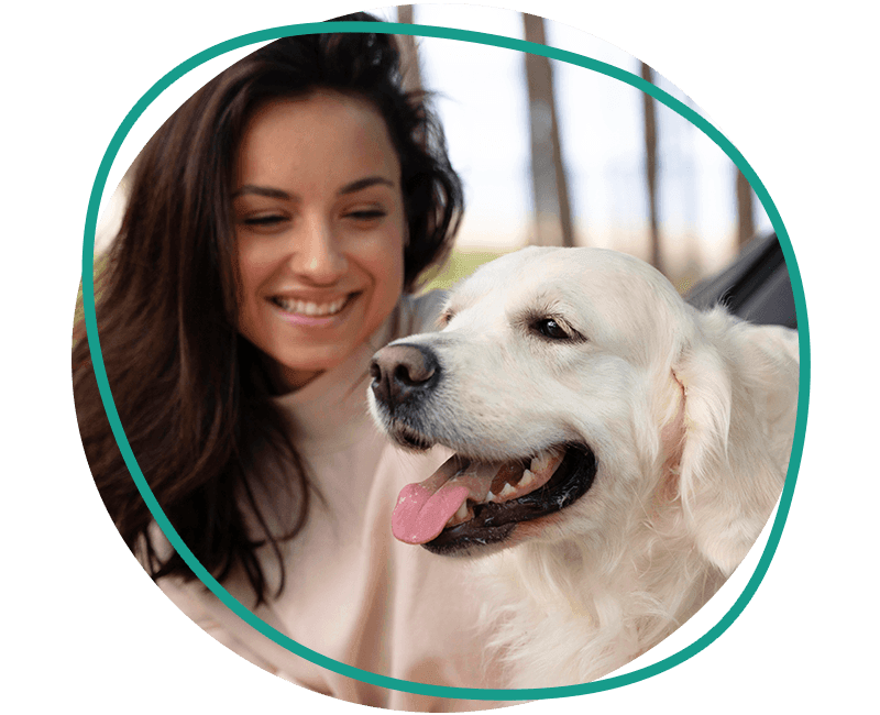 woman holding happy dog